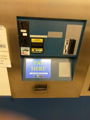 Pay station, takes cash and card.