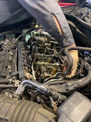 Performing a valve clearance on a 2010 Honda Accord.