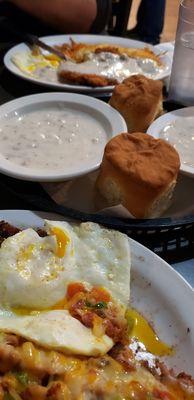 Breakfast - mixed plate, decked out hashbrowns, biscuits and gravy, and chicken fried steak.