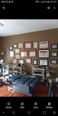 Treatment room and 41 years of awards in holistic medicine.