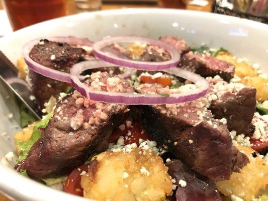 The grilled cajun steak salad with tater tots