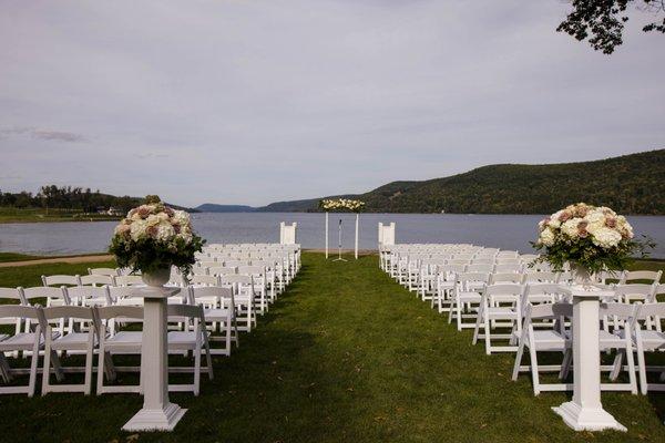 Nice ceremony shot, see close up on the aisle pieces & arch.