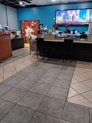 Large waiting area with sushi station.