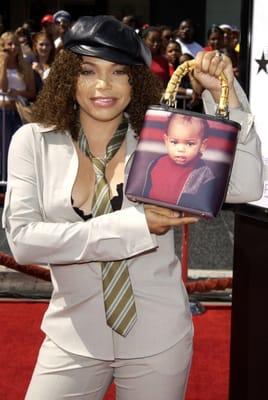 Trisha Campbell looking fly on the red carpet with her Gina Bag