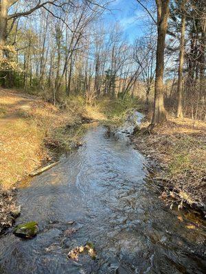 Across the street is The Grist Mill with the running stream with glacier rocks @ Martha Mary Chapel @ Longfellow's Wayside Inn Sudbury MA