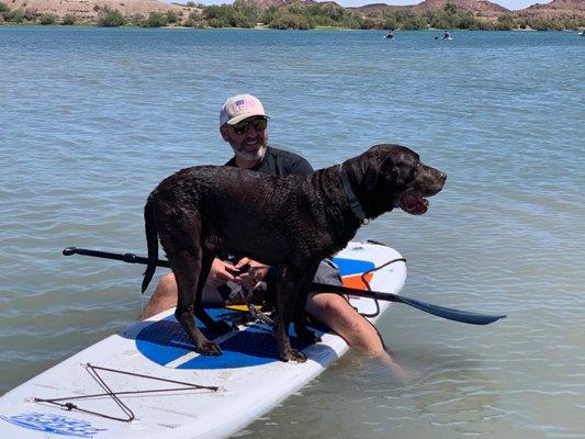 Owner of Leto's Rentals and his buddy Sam enjoying some time on a paddleboard!