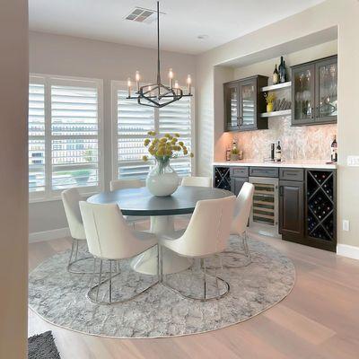 Experience luxury with our full-service kitchen design. This elegant dining area complements a stunning, modern kitchen.