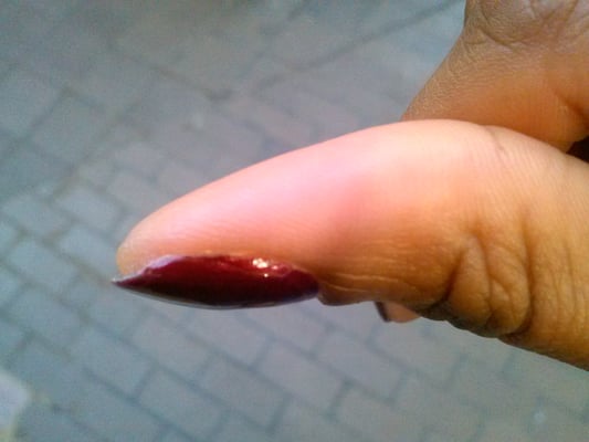 jagged nail not fully painted.