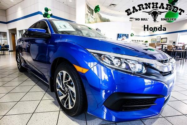 Blue Sedan in the showroom