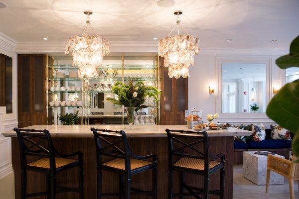 Custom bar in waiting area offers infused waters, antioxidant tea and pour-over coffee for patients