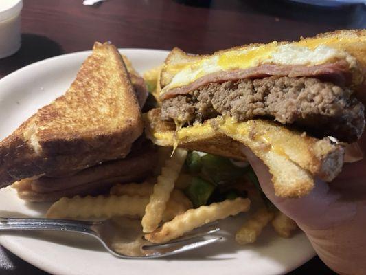 I can't spell what they call this but, hamburger with ham, fried egg situated between two grill cheeses for buns...good!!