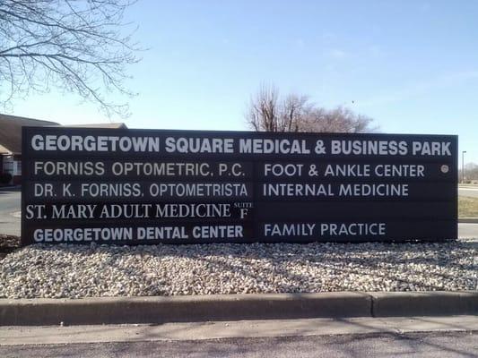 Large sign by entrance of parking lot for Foot & Ankle Institute.