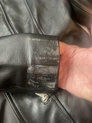 This is a brand new jacket and I took the sticker off that they put on and the leather peeled off