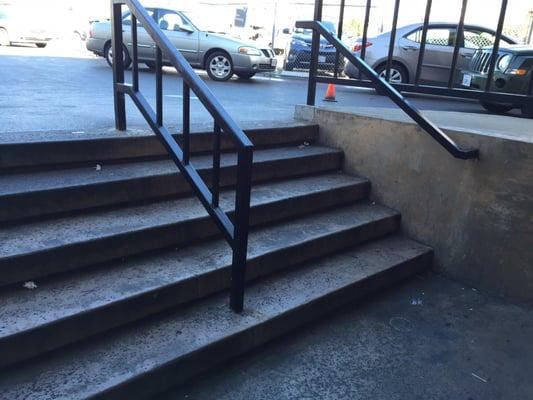 Parking lot access stairs are very dirty and need to be power washed or painted.