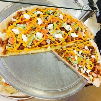 Come in and try one of are many varieties of slices promise u wont be disappointed this here is are taco pizza for all steak lovers