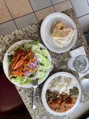 Rice, curries, paneers, salad, pickled carrots, naan