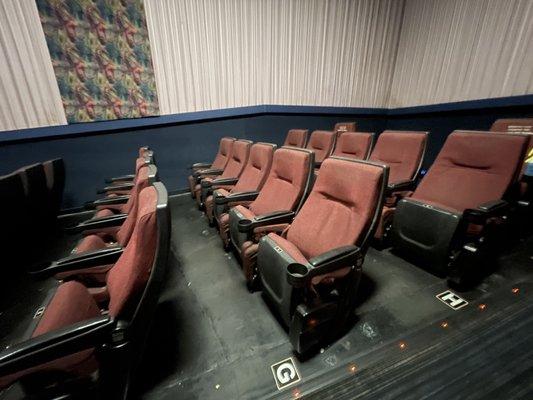 Rocker chairs in theater #4.  Lots of leg room.  Not as comfortable as recliners, but still good.