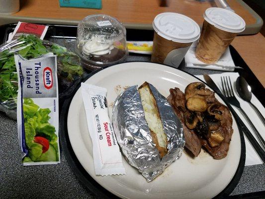 Petite steak/mushrooms, baked tater with fixins, salad/dressing, hot tea n chocolate pudding. Hospital food has EVOLVED.