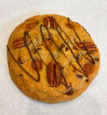 Turtle cookie so delicious with Pecans, Chocolate Chips, Caramel bits drizzled with Dark Chocolate