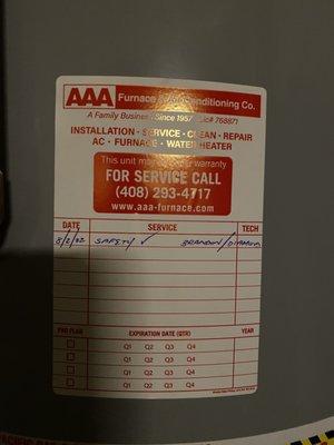 Service record sticker on water heater.