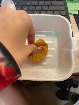 Single, droopy, greasy, tiny, sad onion ring