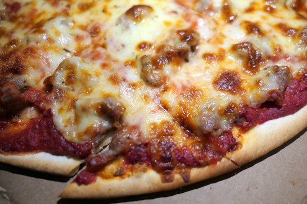 Thin crust sausage pizza