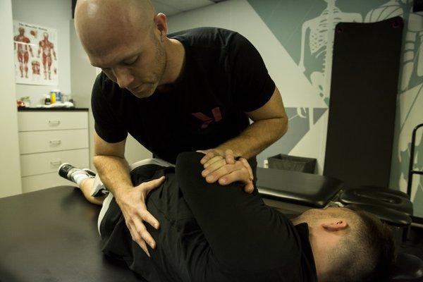 Dr. Abney performing a spinal manipulation.