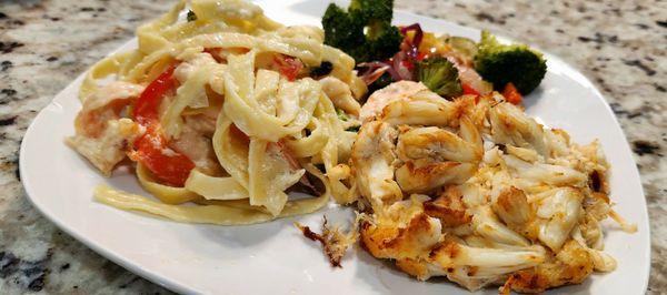 Shrimp fettuccine pasta alfredo, broiled 8oz crab cake, seasonal vegetables