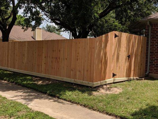 Cedar wood fence with rot board