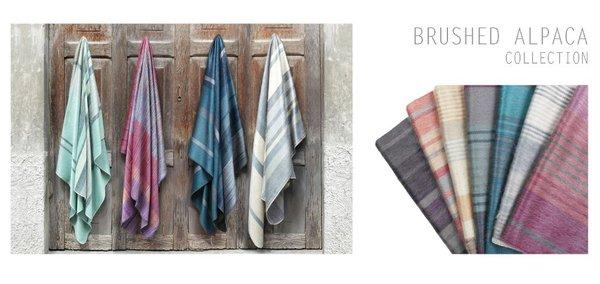 BRUSHED ALPACA SCARVES AND BLANKETS FROM ECUADOR MADE BY ARTISANS WORKING UNDER FAIR TRADE GUIDELINES.