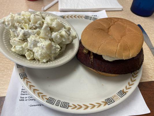 Bologna burger with potato salad.