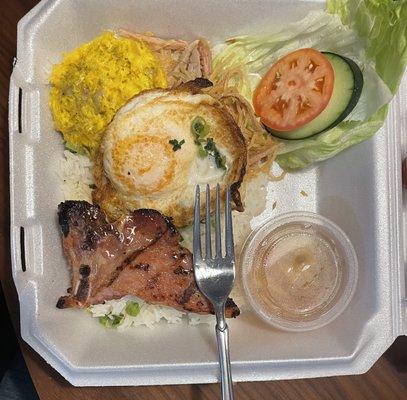 This is the pork chop. No I did not eat any of it before taking the photo. It's half bone, so about an ounce and a half of meat for $15.