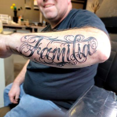 Familia forearm tattoo by Summer at Ink Vault Tattoo Studio in Clinton Township MI