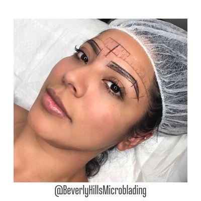 Perfecting the brow shape before microblading is crucial.