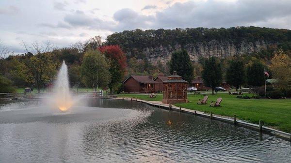 Fishing pond, fountain, gazebo, and mountain view.