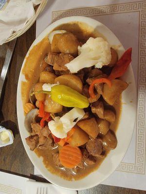 Pork and littlenecks in strange brown gravy.