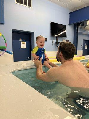 Infant & toddler class -  baby leans forward to jump in with confidence