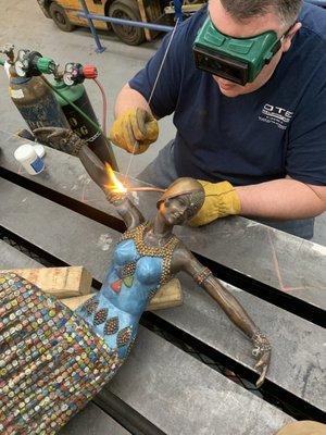 Bronze statue repaired so well you cannot even see the weld or where it was broken.