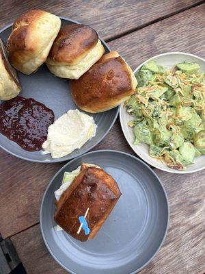 Fish slider, cucumber salad and rolls