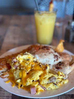 Scrambled eggs, hash browns, and gravy