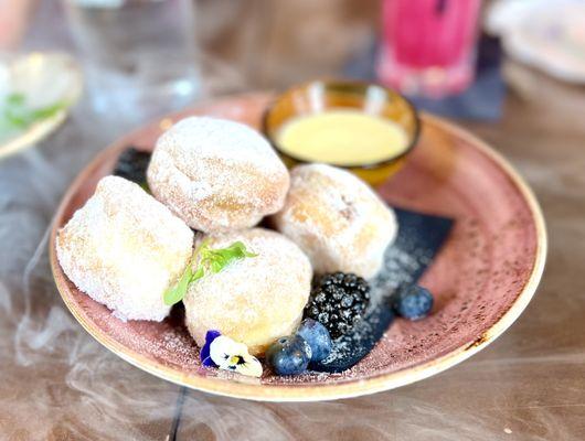 Bomboloni - donuts with vanilla custard. Delicious.