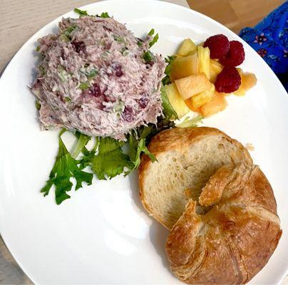 Cranberry pecan chicken salad with croissant and fruit salad