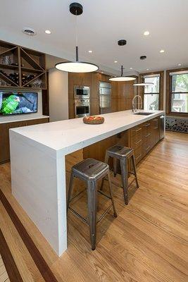 Bar seating and custom wine storage make the kitchen the heart of the home