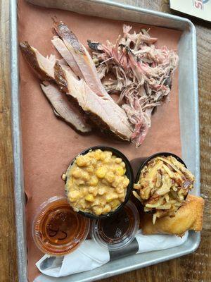 Smoked turkey, pulled pork, bacon and cheese potatoes, and jalapeño creamed corn