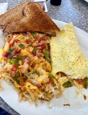 Ranch omelet with loaded hashbrowns and wheat toast