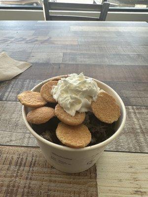 Cookies and crème non dairy ice cream with whipped crème and vanilla wafers on top