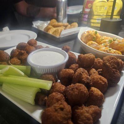 Fried mushrooms, in the back fried pickles and firecracker shrimp