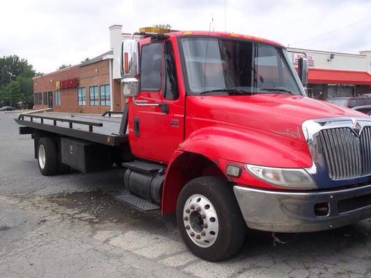 Roll-back Tow Truck. Specializing in professional service throughout the Charlotte metro area.