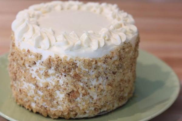 Carrot cake - moist and delicious with raisins and walnuts, covered in creamcheese frosting