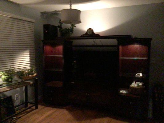 Heavy Entertainment center with two towers, TV stand and upper shelf plus TV